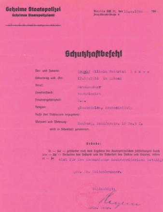 Schutzhaftbefehl Rudolf Essers der Geheimen Staatspolizei auf rosanen Papier.
